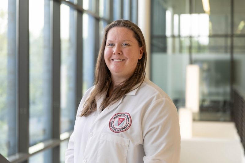 Faculty Awards Headshot of Jessica Gilbertie in a white lab coat