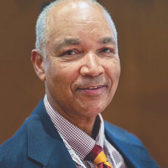 Ted King. portrait of older man with blazer and tie