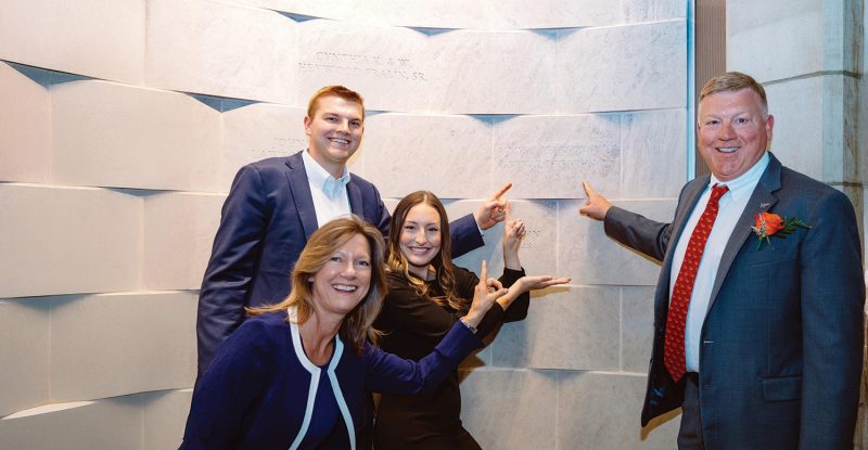 Alumni J. (far right) and Renae (bottom left) Pearson were recognized as Foremost Benefactors during a ceremony at Burruss Hall in April 2022. Photo by Christina Franusich for Virginia Tech.