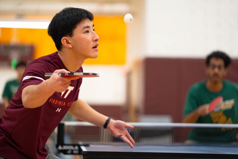 Virginia Tech student Ethan Do playing table tennis.