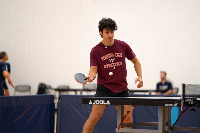 Virginia Tech student Kian Sepahpour playing table tennis.