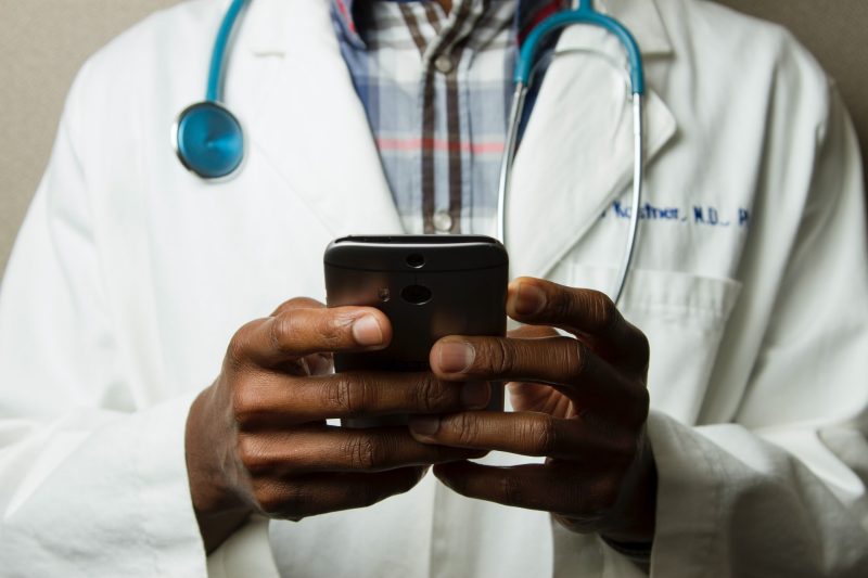 photo of a doctor using a smartphone