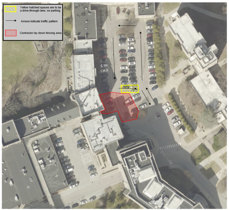 An aerial map view of Smyth Hall and the surrounding area. A red circle is around six parking spots behind Smyth Hall to denote a parking spot closure. A yellow square surrounds four parking spots to denote a parking spot closure.