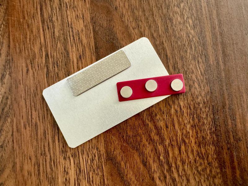 A magnetic backed name tag