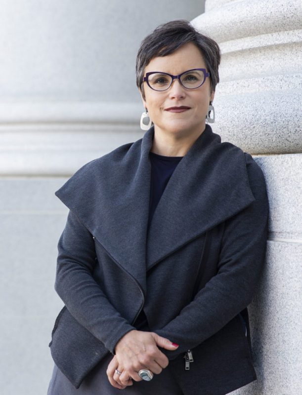 Professional photo of Lisa García Bedolla posing outside U C Berkeley