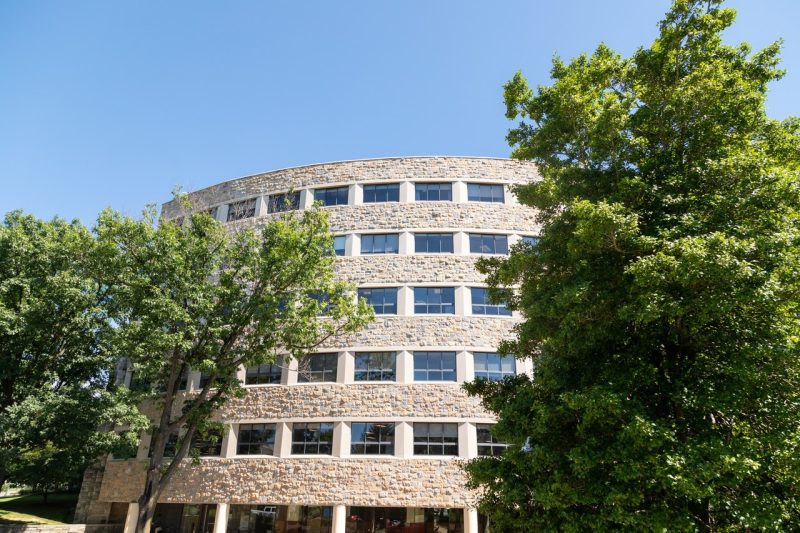 The curve of Newman Library on a sunny day.