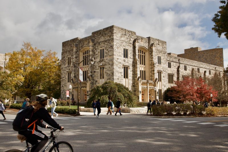 A photo of the outside of Newman Library with changing fall leaves.